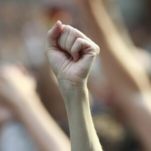 Hands and fists raised in the air.
